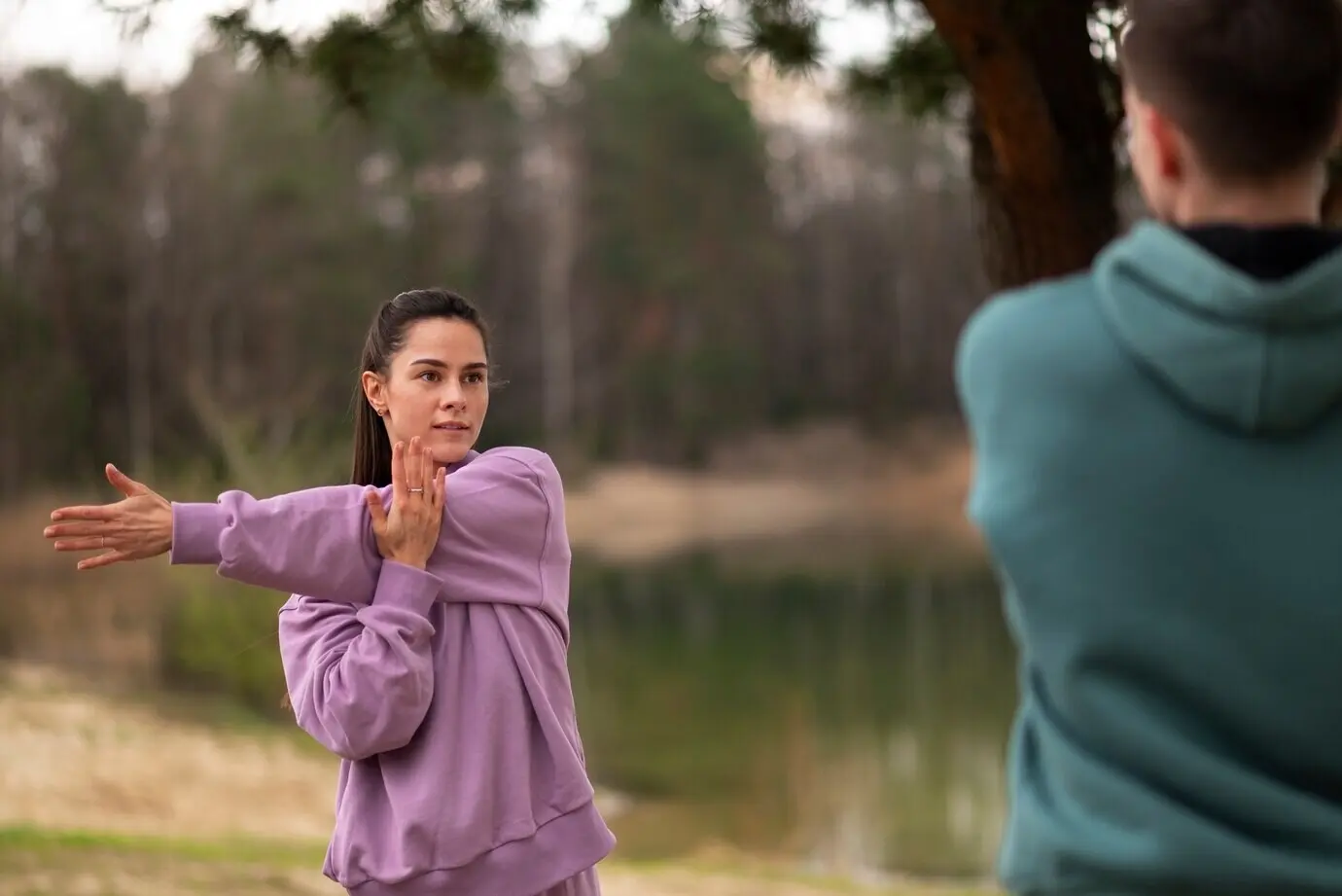 Front-facing view of a man and a woman training